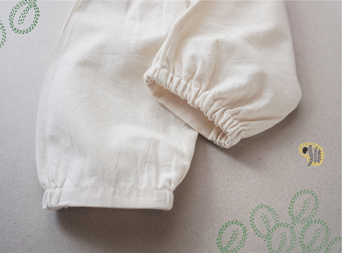 Pale Ivory Pleated Pants